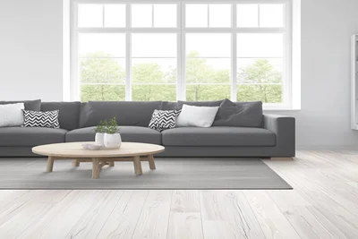 Helles Wohnzimmer mit moderner Einrichtung – Symbol für den Immobilienverkauf im Ostallgäu